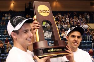 Basketball players holding trophy